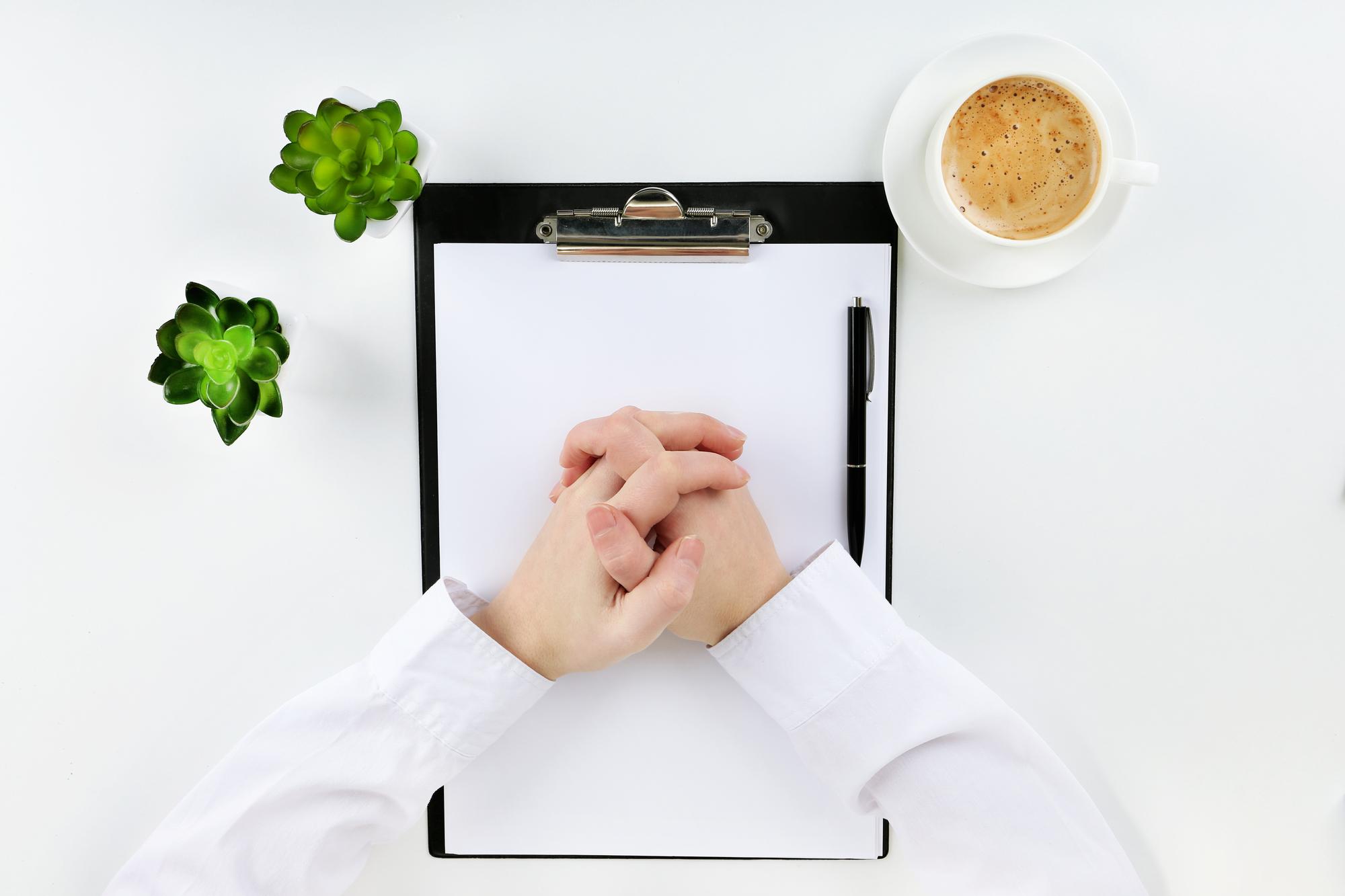 Consultation over a recipe sheet on a table
