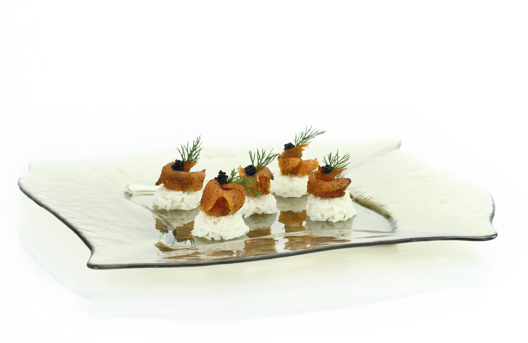 Row of appetizer plates on a prep table